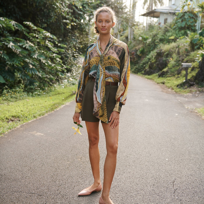 Front image of a woman standing wearing the Fletcher Short—Nep Suiting in Safari