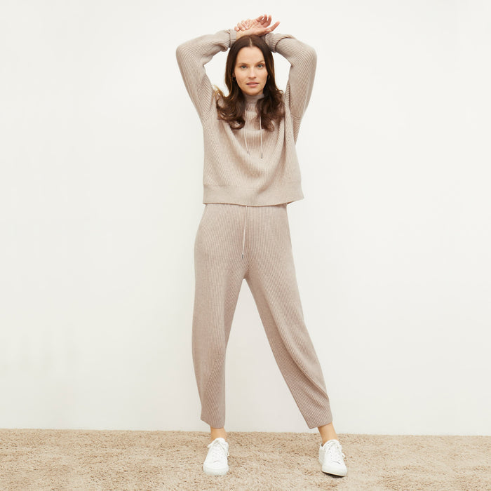 Front image of a woman standing wearing the Addison Jogger—Cashmere/Wool in Oatmeal Melange