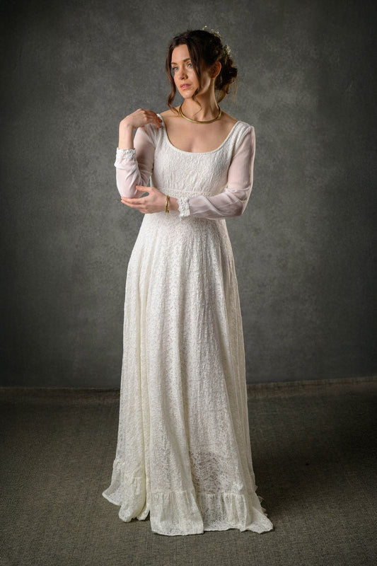 Annagh ivory cotton lace Regency wedding dress with scoop neckline, sheer bishop sleeves and flowing regency-inspired skirt