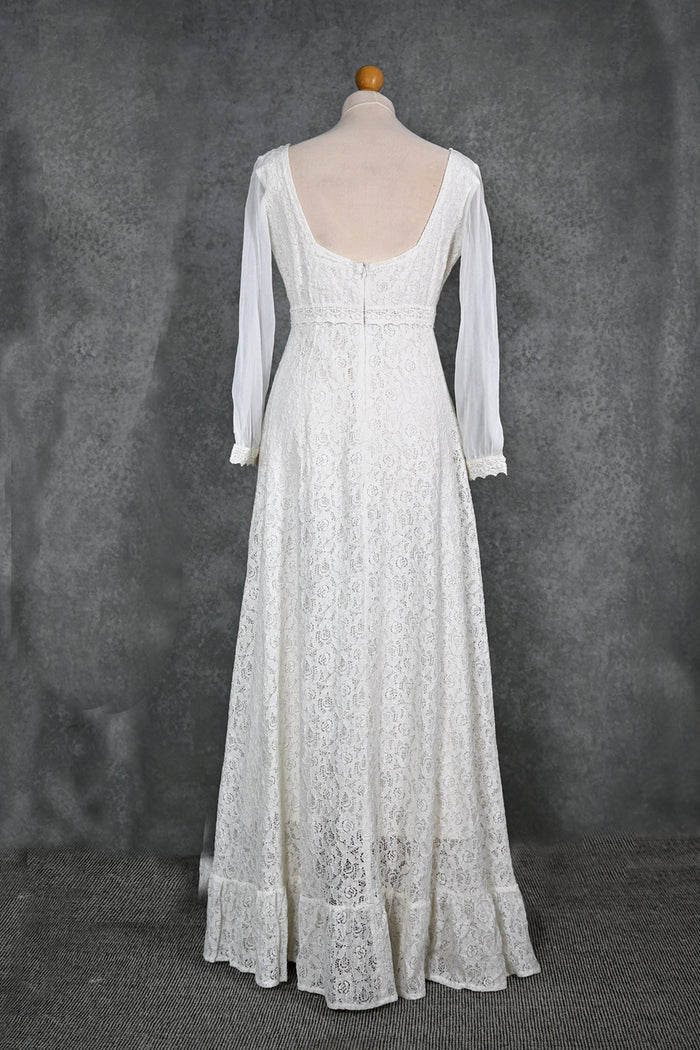 Annagh cotton lace wedding dress on mannequin with low V back, lace sleeves and softly flared skirt