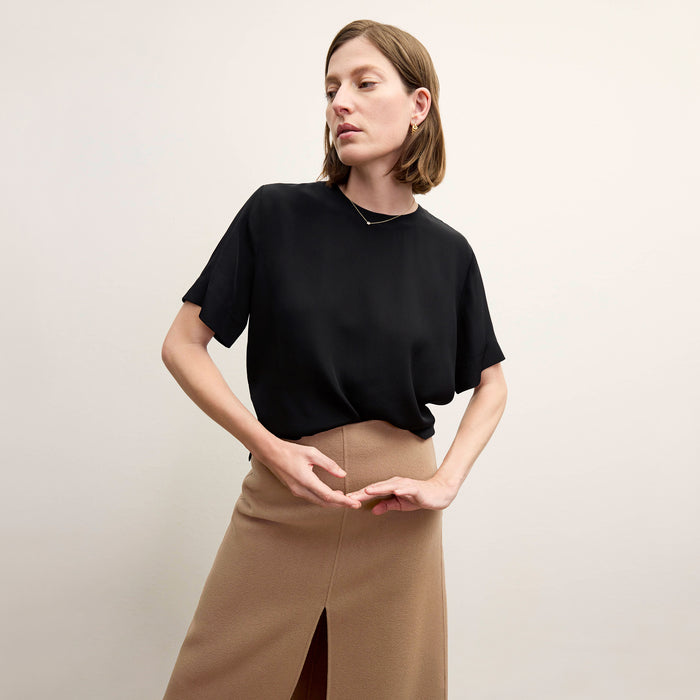 Front image of a woman wearing the Annika Tee - Washable Silk in Black | Lead
