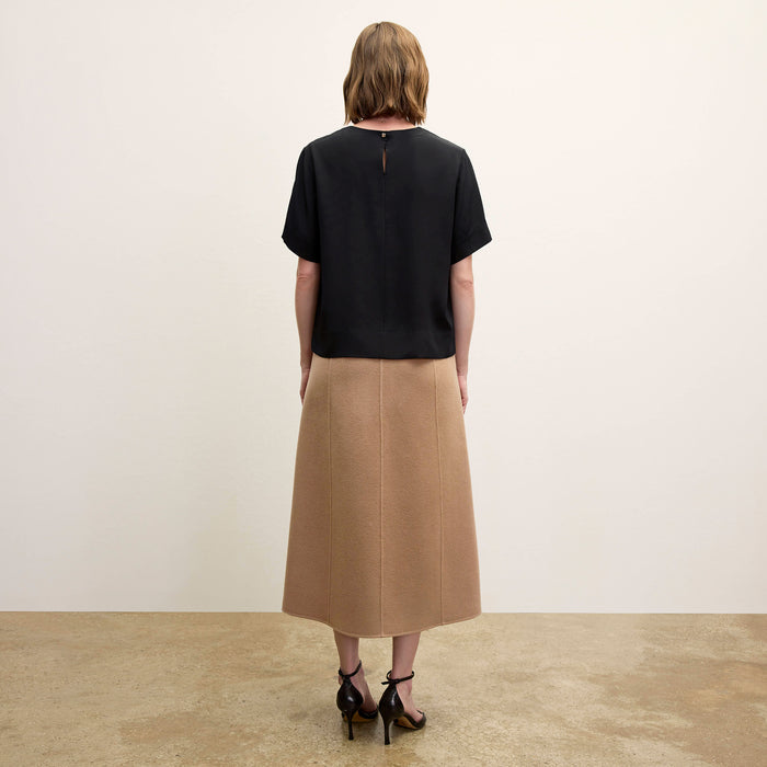 Back image of a woman wearing the Annika Tee - Washable Silk in Black