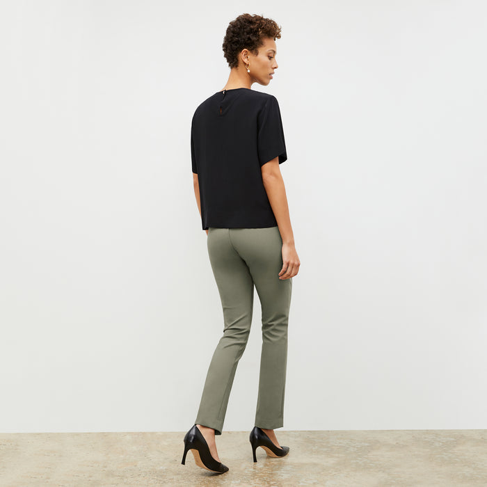Back image of a woman wearing the Annika Tee - Washable Silk in Black