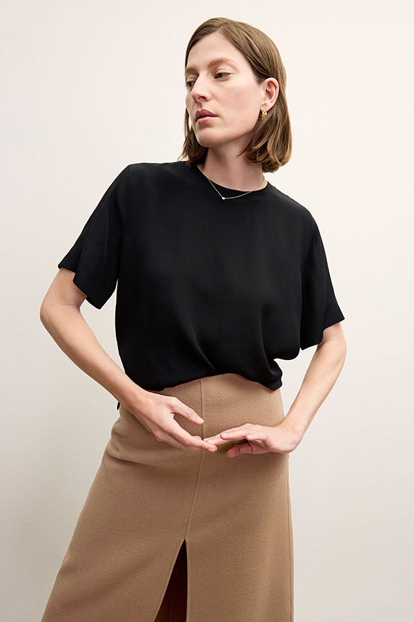 Front image of a woman wearing the Annika Tee - Washable Silk in Black | Exclude | Grid