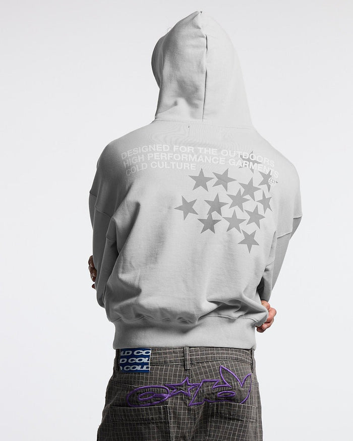 ASTRO HOODIE - light grey star print hoodie, back view on male model - Cold Culture #man