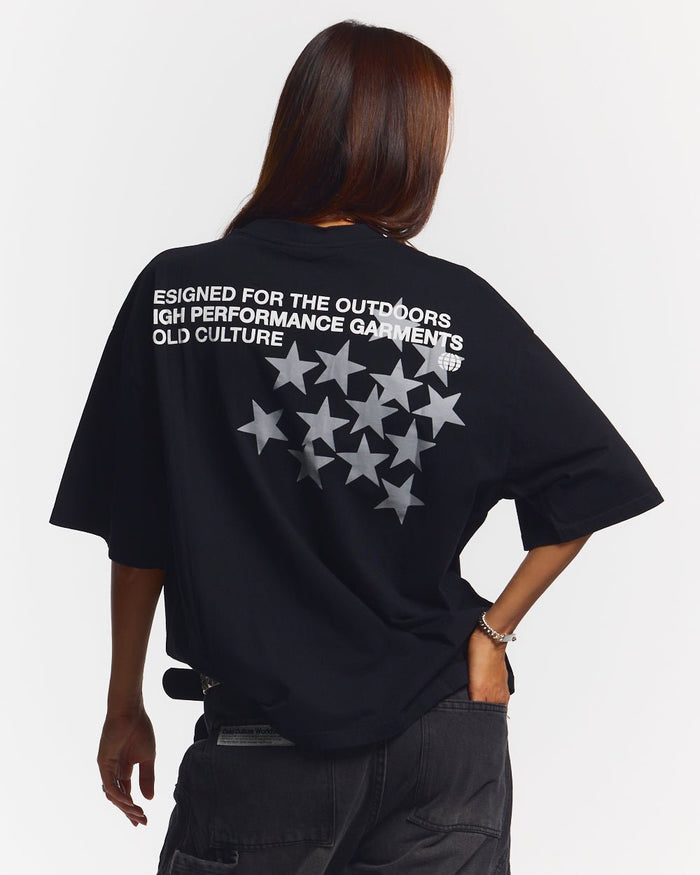 ASTRO TEE BLACK - black star print tee, back view on female model - Cold Culture #woman