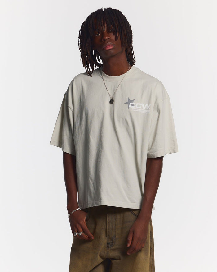 ASTRO TEE LIGHT GREY - light grey star print tee, front view on male model - Cold Culture #man