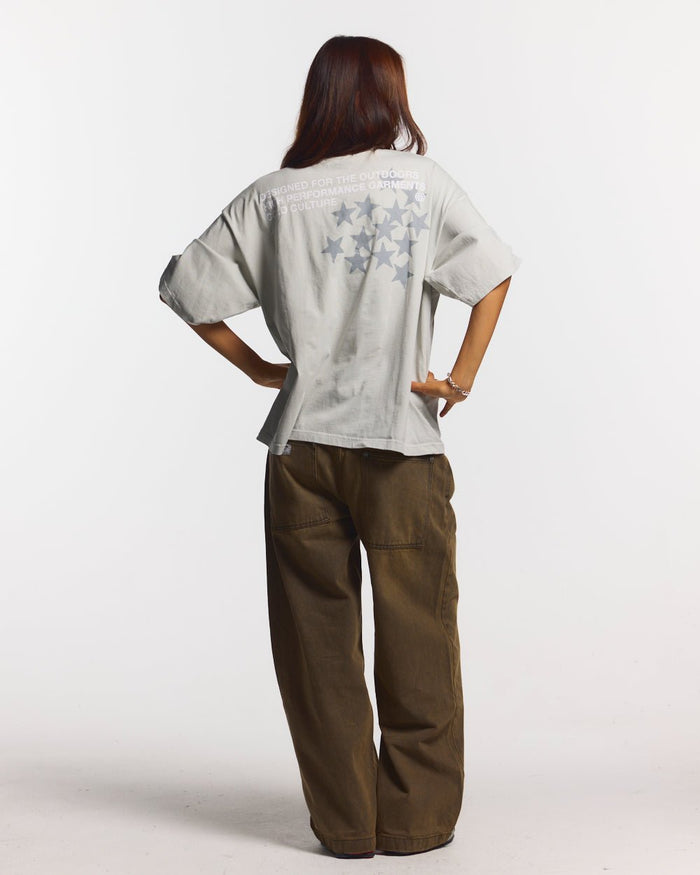 ASTRO TEE LIGHT GREY - light grey star print tee, back view on female model - Cold Culture #woman