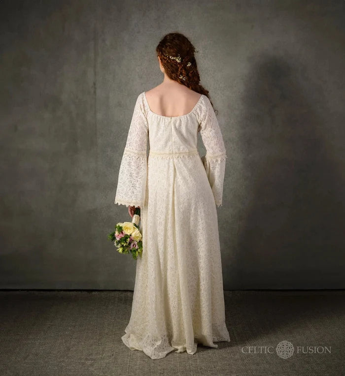 Bébhinn Boho Lace Wedding Dress back view, sustainable cotton lace gown with bell sleeves and flowing full-length skirt.