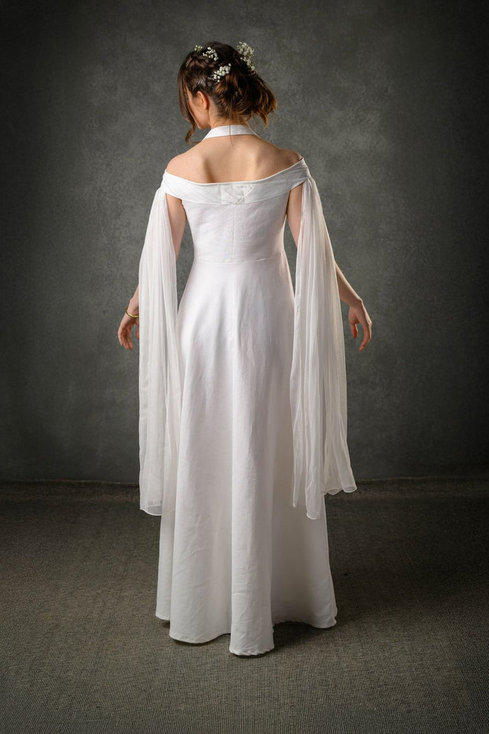 Linen Irish designer sustainable wedding dress with an ethereal look and flowing sleeves
