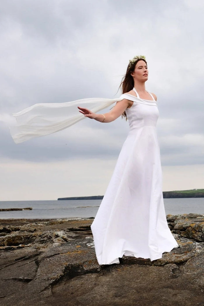Elegant Celtic Fusion Wedding Dress with halter neck, flowing sleeves and flowing silhouette for a beach or outdoor wedding