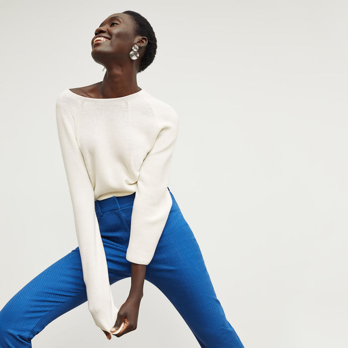 Front image of a woman standing wearing the condesa pant in basketweave jacquard in azure