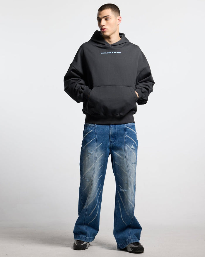 COSMOS ARC HOODIE INDIA INK - washed black star print hoodie, front view on male model - Cold Culture #man
