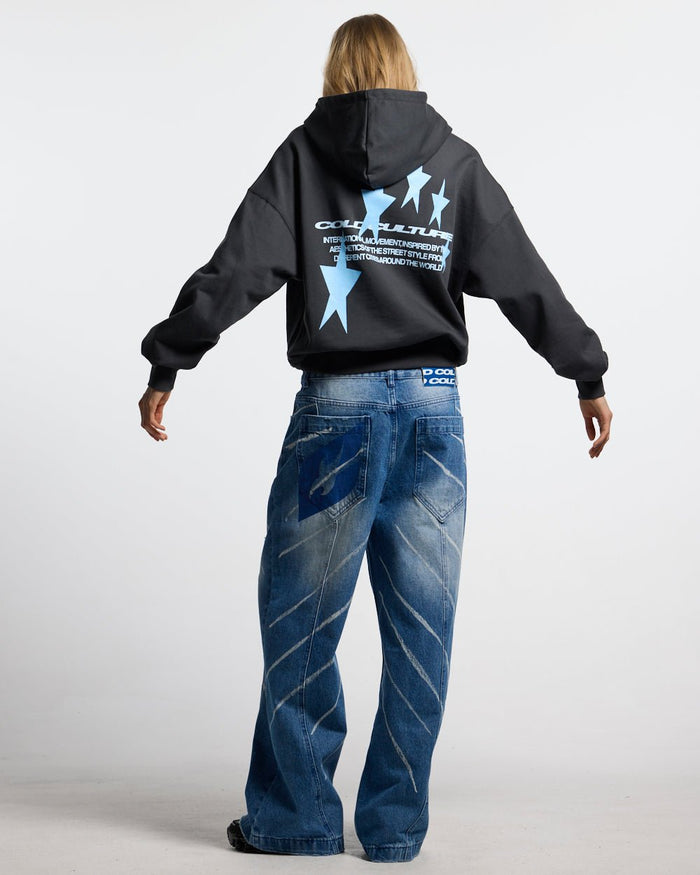 COSMOS ARC HOODIE INDIA INK - washed black star print hoodie, back view on female model - Cold Culture #woman