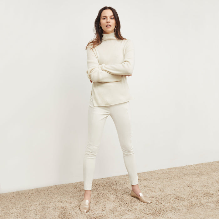Front image of a woman standing wearing the Curie Pant—Everstretch in Bone