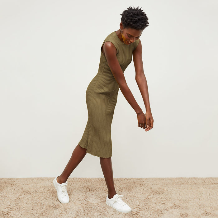 Side image of a woman standing wearing the Dylan Dress in Safari