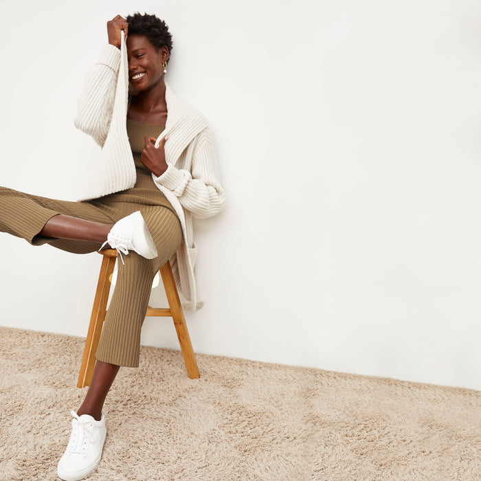 Front image of a woman standing wearing the Finley Legging—Ribbed Jardigan Knit in Light Bronze