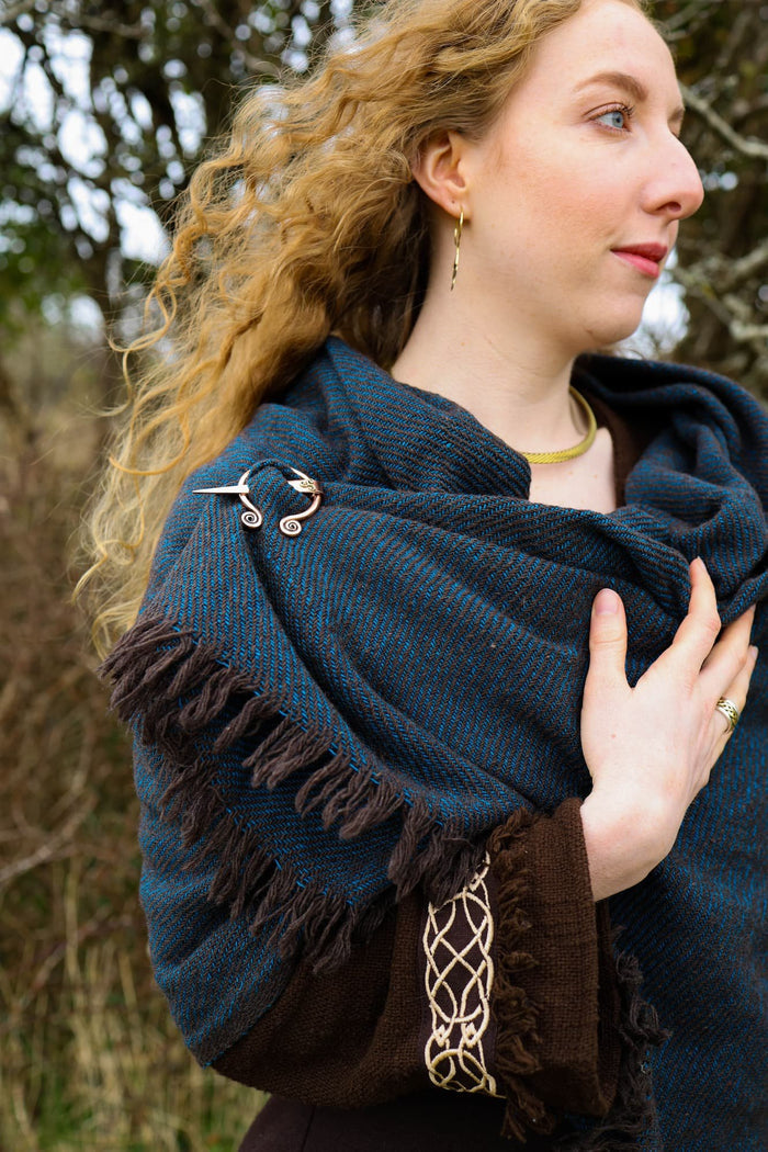 Irish Celtic shawl in black and turquoise with fringe edges and handcrafted Uisneach copper brooch