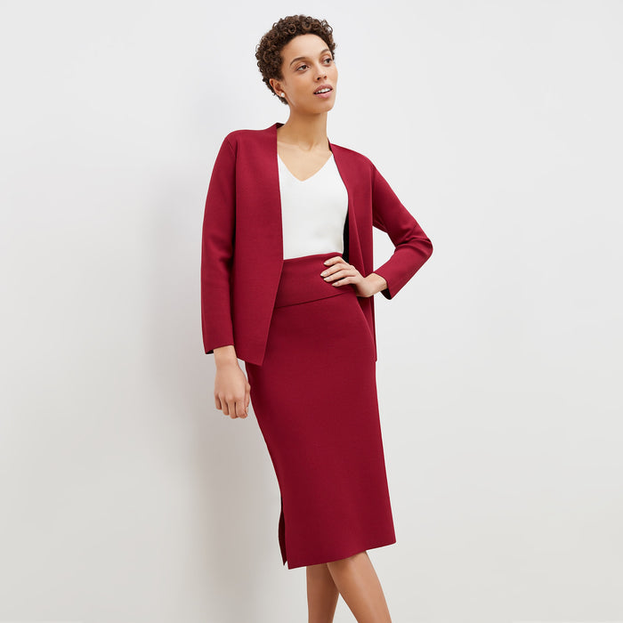 Front image of a woman standing wearing the harlem skirt in hibiscus | Lead