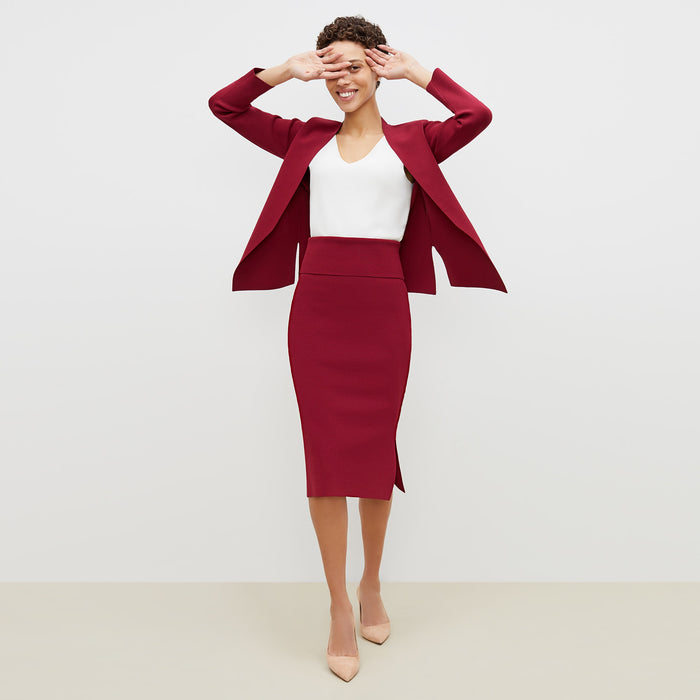 Front image of a woman standing wearing the harlem skirt in hibiscus