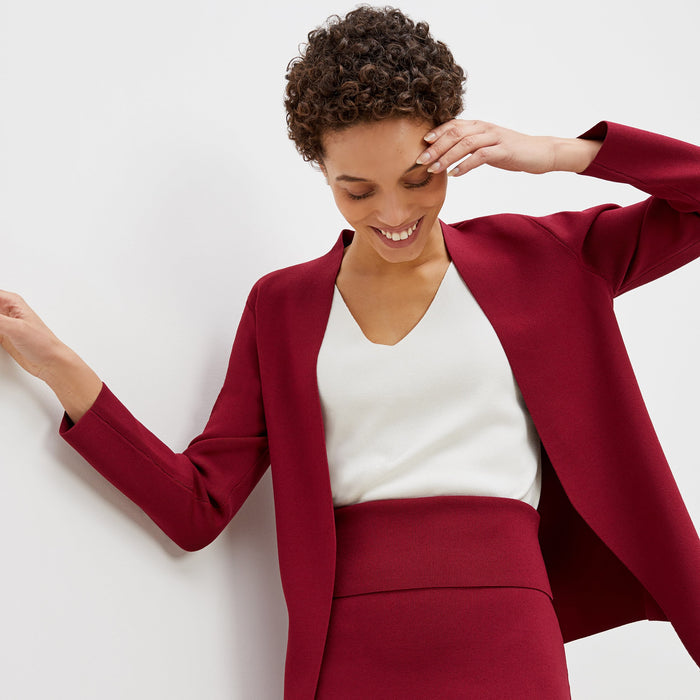 Detail image of a woman standing wearing the harlem skirt in hibiscus