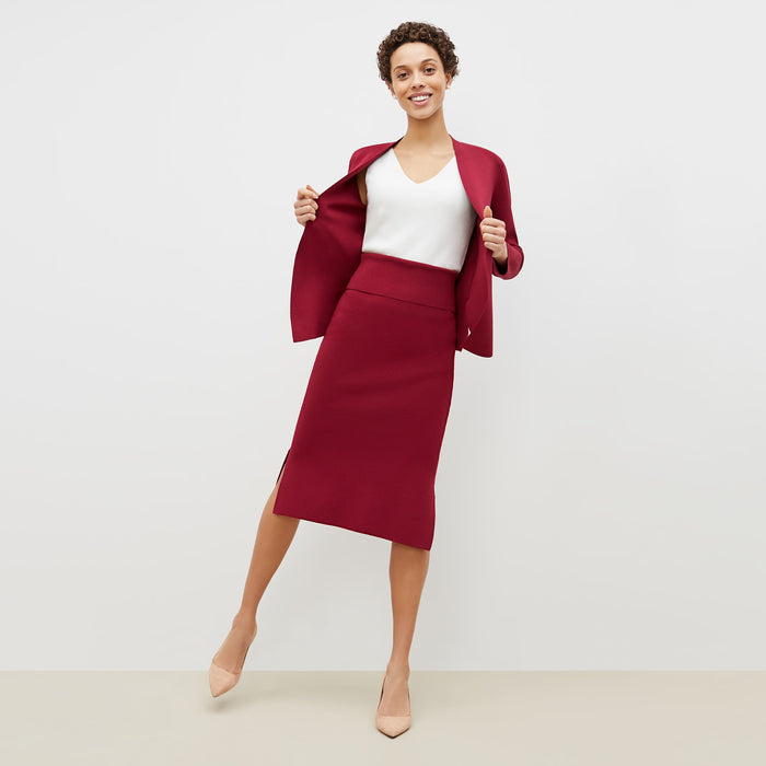 Front image of a woman standing wearing the harlem skirt in hibiscus