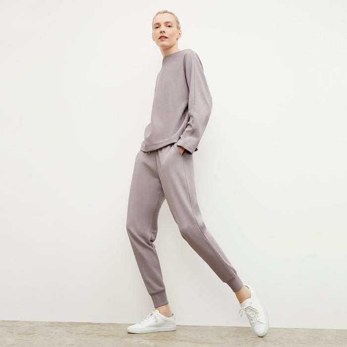 Side image of a woman wearing the Kristin Pullover - French Terry in Wisteria
