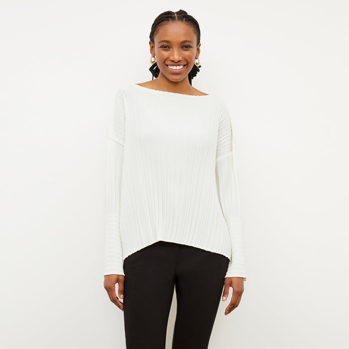 Front image of a woman wearing the Lasha Top - Micro Pleat in Ivory | Lead