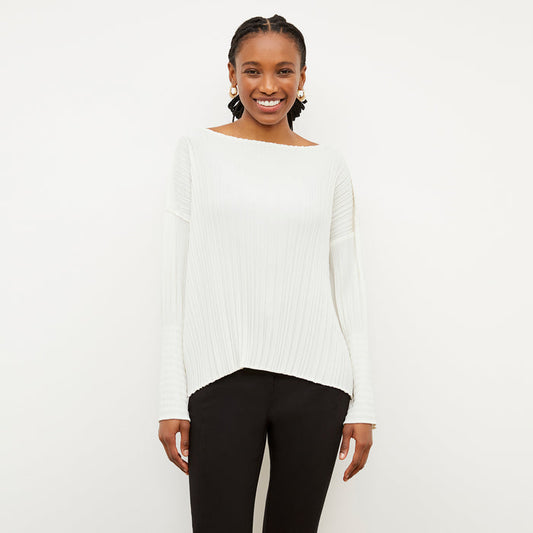 Front image of a woman wearing the Lasha Top - Micro Pleat in Ivory | Lead