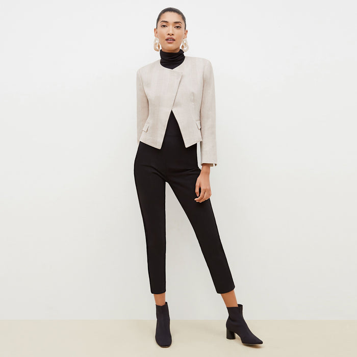 Front image of a woman standing wearing the Marais pant in black | Lead