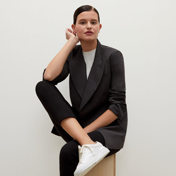 Detail image of a woman standing wearing the Marais pant in black
