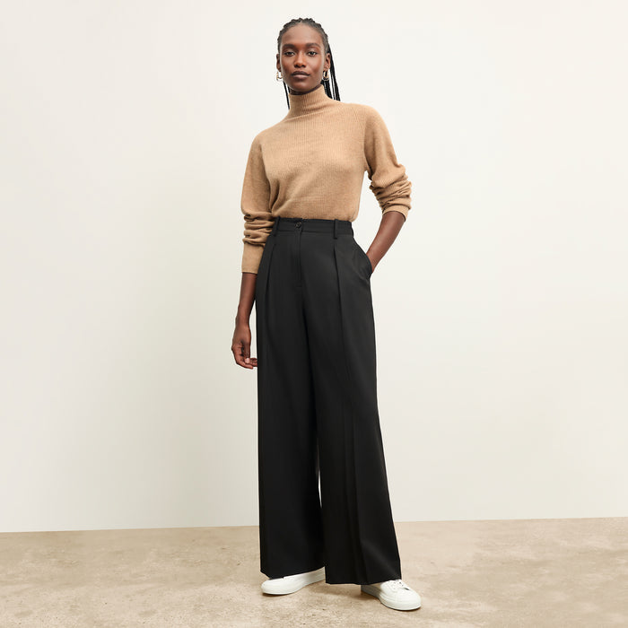front image of a woman wearing the mckenzie sweater in deep flax