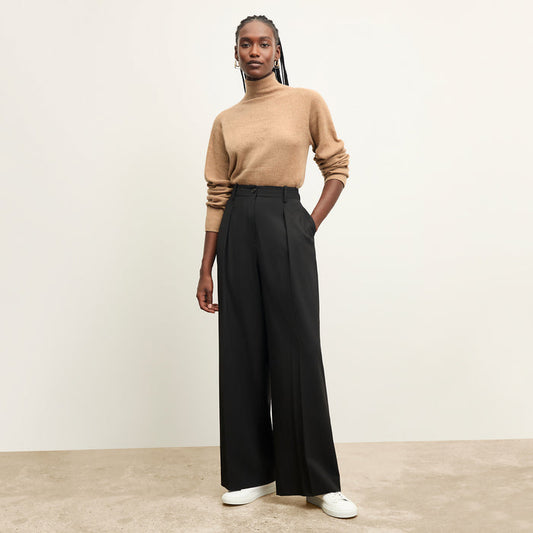 front image of a woman wearing the mckenzie sweater in deep flax