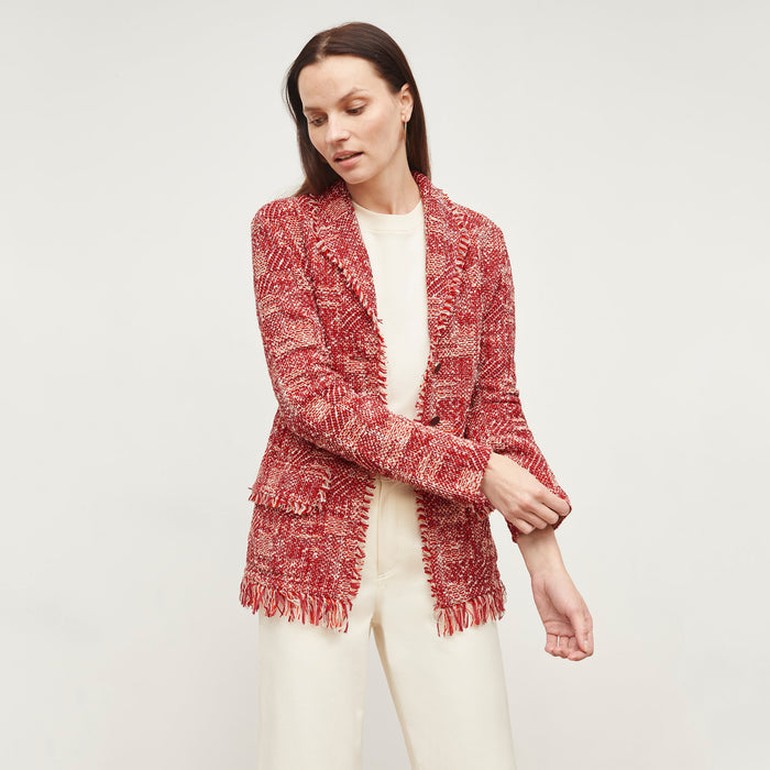 Front image of a woman standing wearing the Porter Jacket—Interweave in Red Multi  | Lead