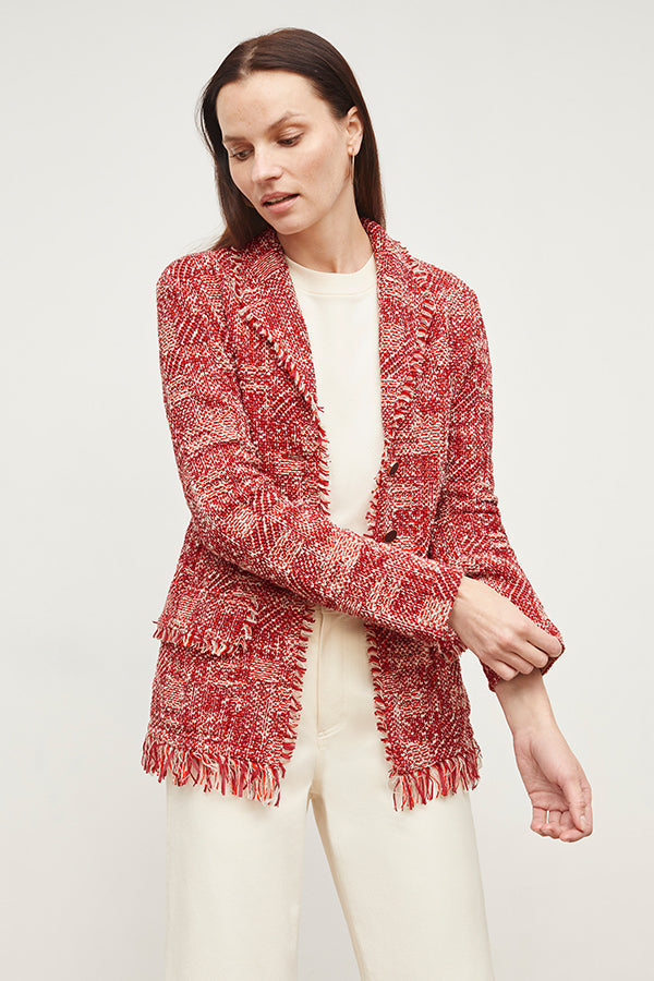 Front image of a woman standing wearing the Porter Jacket—Interweave in Red Multi | Grid | Exclude