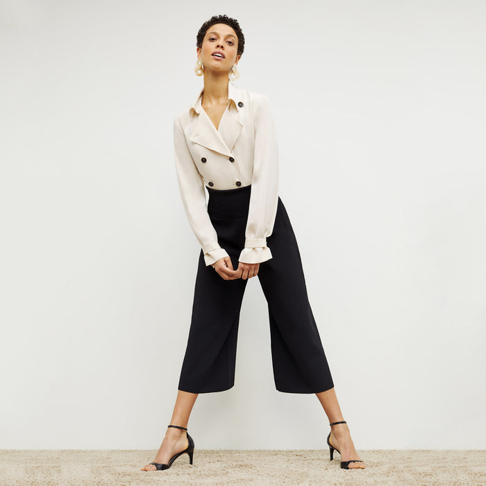 Front image of a woman standing wearing the Rogala Pant—Jardigan Knit in Black