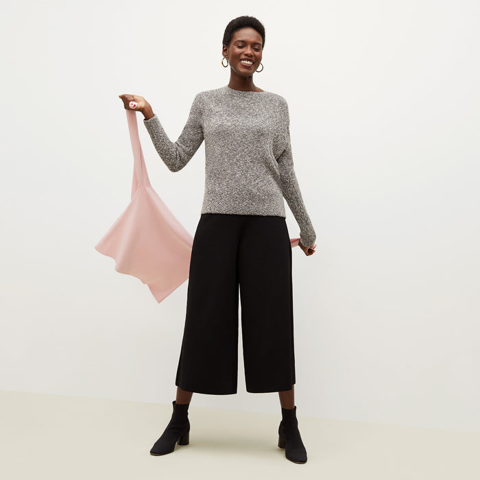 Front image of a woman standing wearing the Rogala Pant—Jardigan Knit in Black