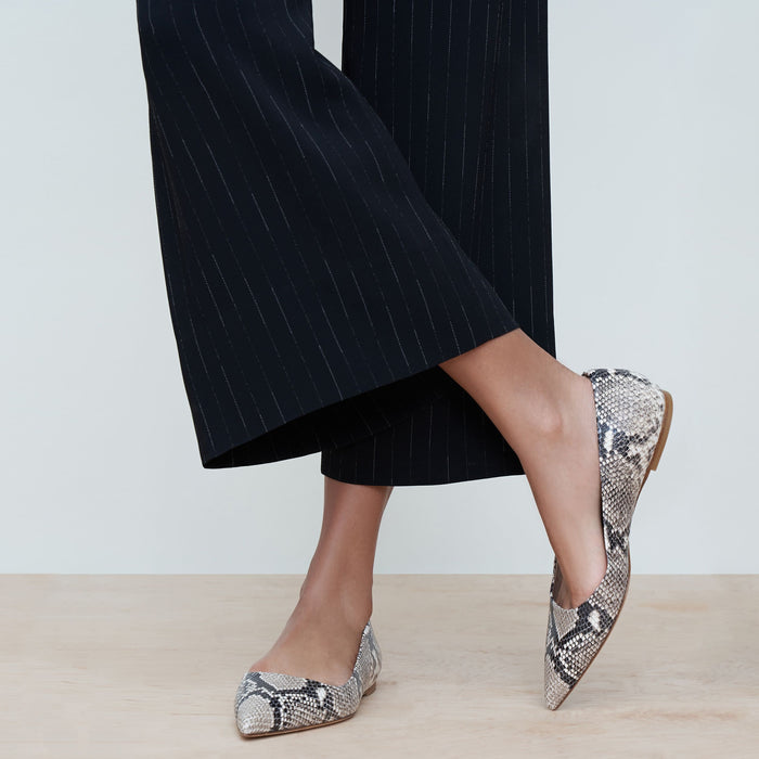 Woman standing wearing the rowan flat snakeskin