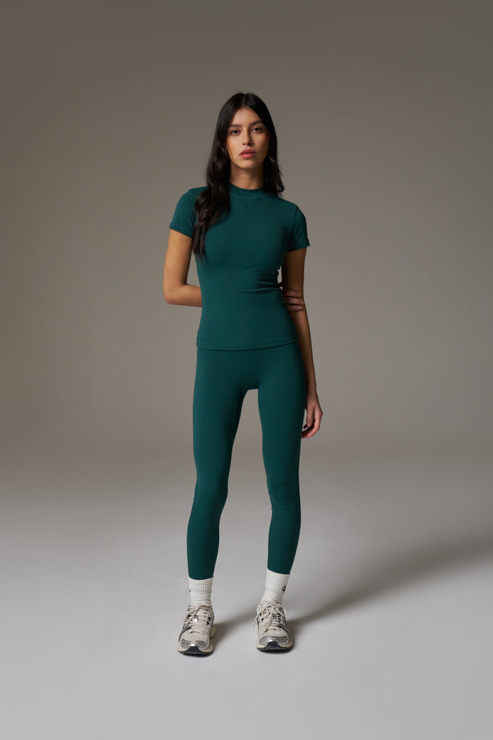SCULPTING STRETCH EMBLEM BABY TEE - FOREST GREEN