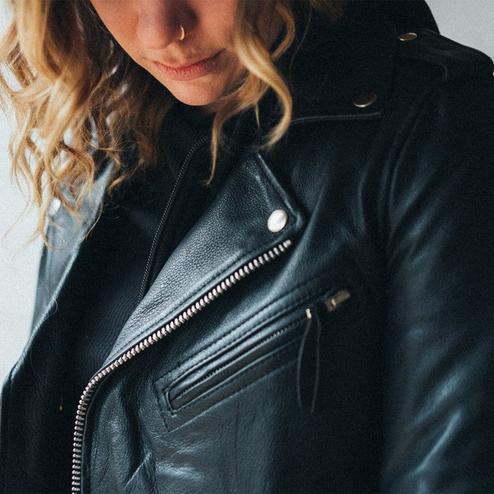 Women's Ryman black leather motorcycle jacket lapel and chest zipper detail