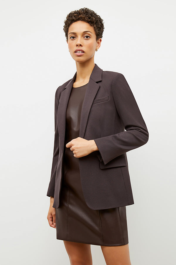 Detail image of a woman standing wearing the Yiyan Blazer in Haze | Exclude | Grid